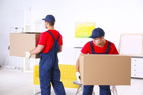 Moving boxes and furniture being prepared for an Enfield removals service