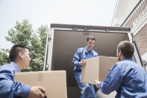 Moving team loading boxes and furniture for an Enfield relocation