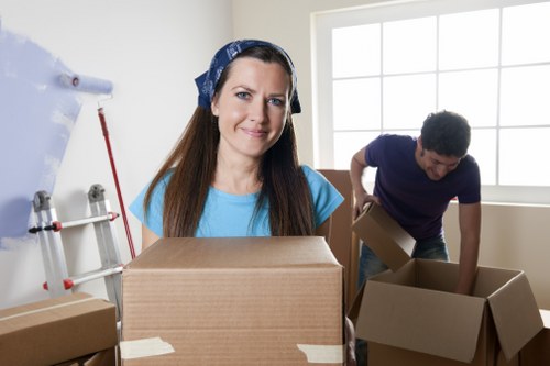 Furniture and packed boxes being arranged inside a removals van