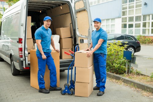 Packed boxes and furniture ready for removal van transport