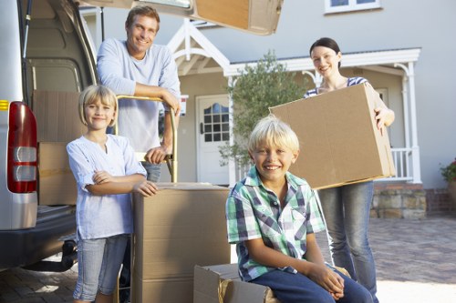 Unpacking service helping a family settle into a new Enfield home