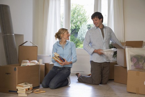 Mover wearing PPE while transporting furniture