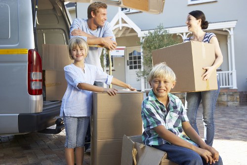 Professional movers handling furniture during a residential relocation in Enfield
