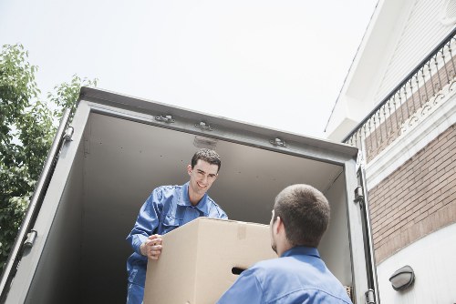 Unpacked boxes and furniture placed in the new home after an Enfield move
