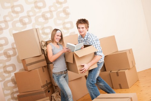 Workers coordinating a house move with clear safety awareness