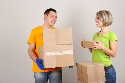Local moving truck loading furniture in Enfield