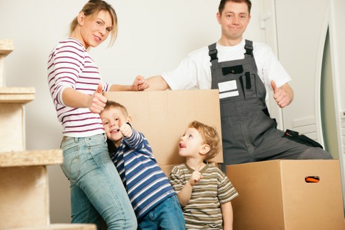 Staff using manual handling techniques and equipment during a removal